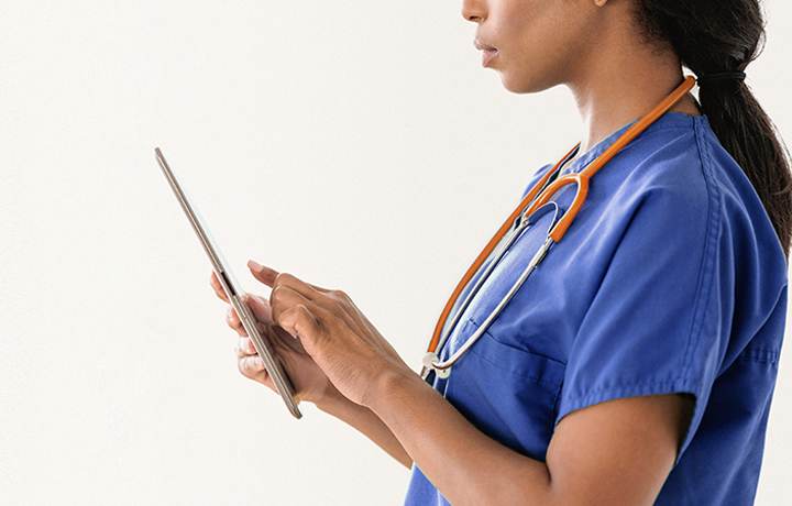 nurse reviewing tablet