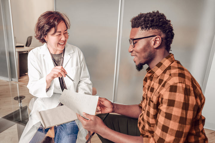 Doctor and Patient Laughing Together