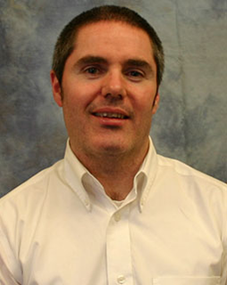 Portrait of John McGuigan, PhD