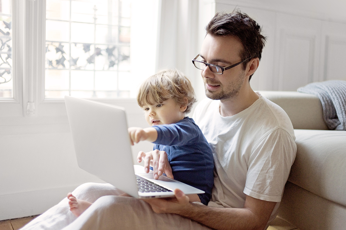 Father and toddler son shopping for health essentials online