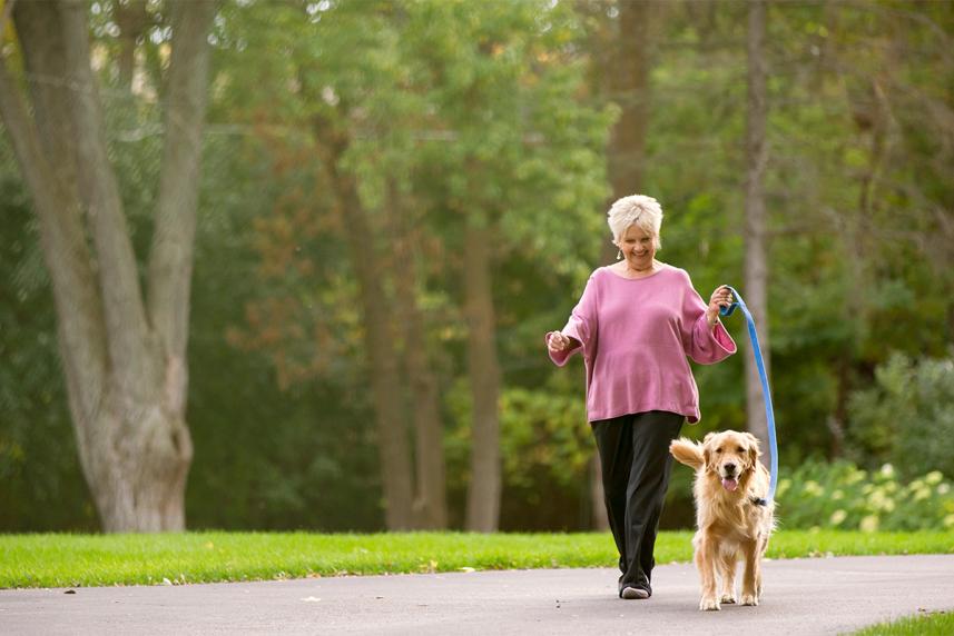 Woman walking with her dog for an article on COPD