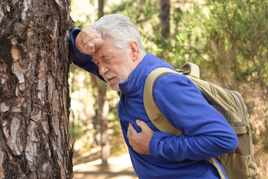Man hiking with breathing problems