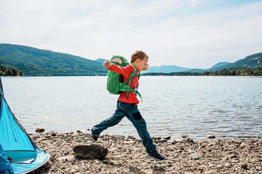 Child skipping along the shore for an article on outdoor safety