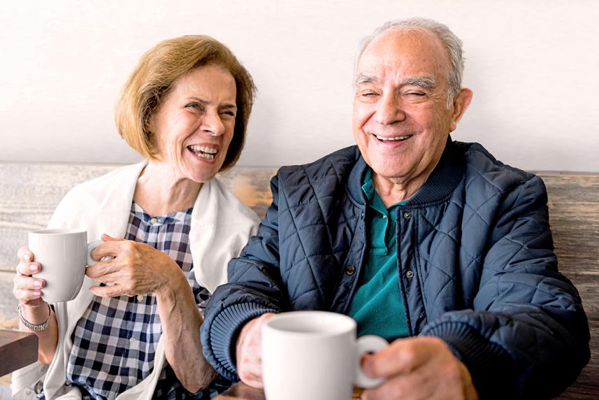 Happy senior couple drinking coffee