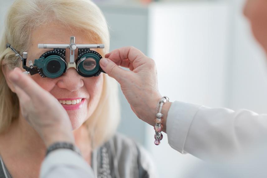 Senior female getting an eye exam