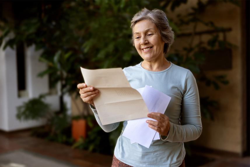 Older woman getting her medicare eligibility letter