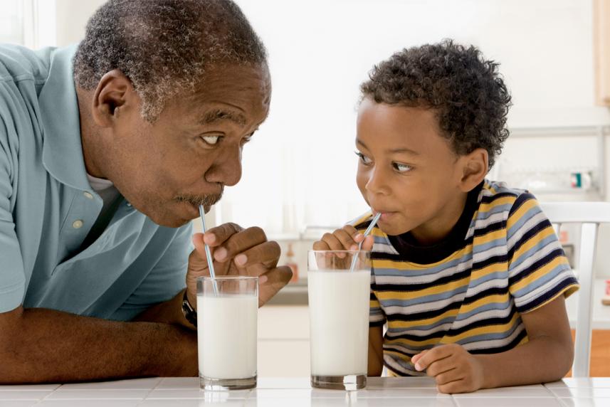 A father and son drinking milk together