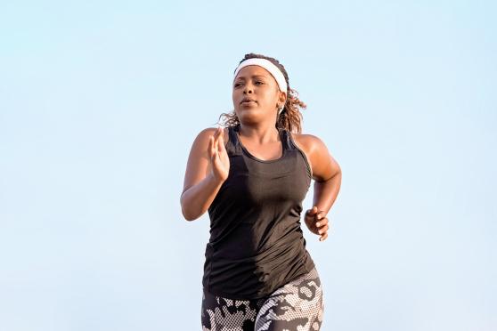 A woman jogging to stay healthy