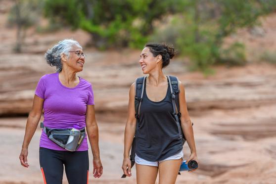 Senior mother and adult daughter hiking 