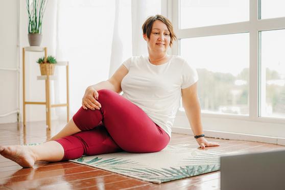 Woman with prediabetes stretching and exercising to prevent diabetes